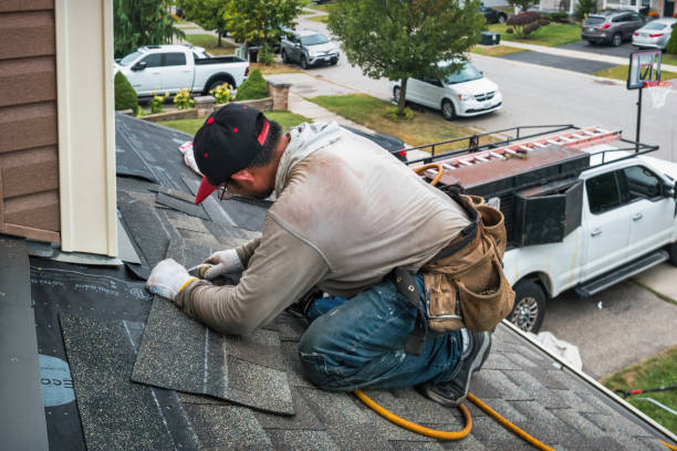 Professional Roofing technician working in Tomkins Cove, NY